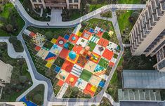 an aerial view of a colorful park in the city