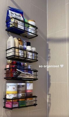 the bathroom shelves are organized with containers and other items to keep them organized in order