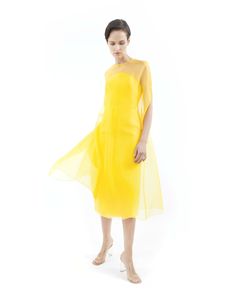 Dune Yellow cape gown made from silk organza, features wide A-line silhouette, round neck, midi length, hook-buttoning on the back and no lining.Offered with matching bustier midi dress sold separately (as shown on pictures) or with lining on request. Flower application is on request with no surcharge. 100% Silk organzaNo liningHook button on the backDry cleanMade in Milan Spring Evening Dress With Sheer Bodice In Organza, Organza Midi Dress With Sheer Sleeves, Spring Midi Dress With Sheer Organza Bodice, Spring Gala Organza Dress, Organza Midi Dress With Sheer Bodice For Evening, Organza Midi Evening Dress, Formal Sheer Organza Midi Dress, Formal Organza Midi Dress With Sheer Sleeves, Spring Cocktail Evening Dress With Illusion Neckline