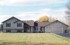 a large house in the middle of a field