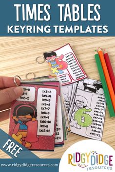 the times tables keyring templates are shown with markers and pencils on a table