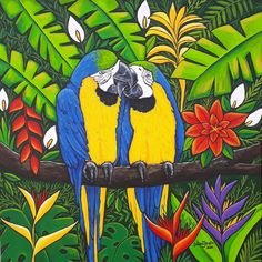 two blue and yellow parrots sitting on a tree branch with tropical flowers in the background