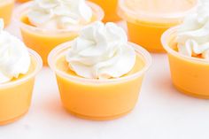 there are many small cups with whipped cream in them