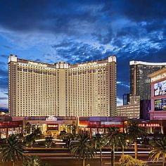 the las vegas hotel and casino is lit up at night