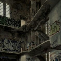 an abandoned building with graffiti all over the walls