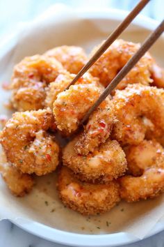 some fried food with chopsticks in it