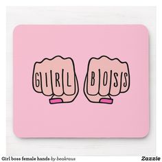 a pink mouse pad with the words girl boss and two fists in front of it