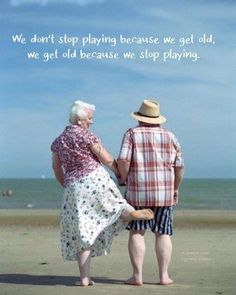 an older couple standing on the beach holding hands and looking at the ocean with a quote written below