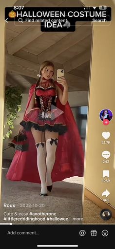 a woman in a costume is taking a selfie