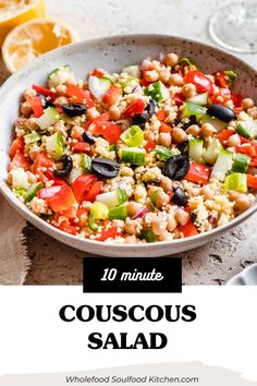 a white bowl filled with couscous salad next to lemons and other food