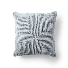 a blue pillow with wavy lines on it