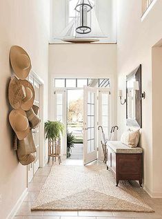 an entryway with white walls and beige carpet