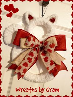 a wreath made to look like a bear with hearts on it and the words, wreaths by gramm