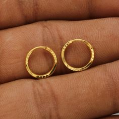 Discover the allure of Handmade Gold Jewelry at https://morvijewels.etsy.com/   Get a dazzling 25% off on all our 22k and 18k gold pieces. Don't miss out on this limited-time offer. Shop now and embrace the radiance of gold! Beautiful yellow gold earrings  Gold Purity- 22k yellow Gold Full Length - 1.3 cm Full Width - 1.3 cm Weight - 0.95 grams approx Click here  https://morvijewels.etsy.com/    to get more discount and offers Happy to take wholesale bulk orders. Small Hoop Gold Cartilage Earrings As Gift, Gift Single Hoop Earring, Handmade Yellow Gold Round Huggie Earrings, Gold Drop Cartilage Earrings As Gift, Gold Drop Cartilage Earrings For Gift, Gold Huggie Cartilage Earrings As Gift, Small Hoop Pierced Cartilage Earrings As Gift, Small Hoop Cartilage Earrings With Ear Wire As Gift, Small Hoop Yellow Gold Earrings As Gift