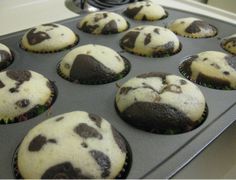 chocolate chip muffins in a baking pan ready to be baked