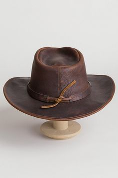 Image Adjustable Leather Fedora With Short Brim, Brown Leather Fedora Hat, Rustic Leather Fedora For Rodeo, Leather Fedora Hats For Rodeo, Leather Fedora With Curved Brim For Outdoor, Brown Leather Brimmed Fedora, Rugged Leather Wide Brim Fedora, Rugged Leather Wide-brim Fedora, Rugged Leather Hat Bands