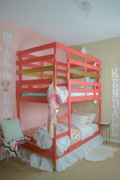 a pink bunk bed in a girls bedroom