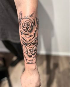 a person with a rose tattoo on their leg