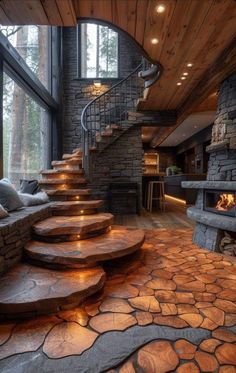 stone steps lead up to the second floor in this modern home with wood and stone walls