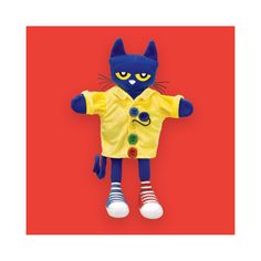 a blue and yellow cat stuffed animal on a red background with the caption's name