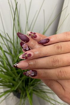 Burgundy Blossoms, stylish autumn nails, autumn nail art, autumn nail designs, trendy fall nails Black And Red Nails Flowers, Burgundy Flower Nail Designs, Dark Red Flower Nails, Almond Maroon Nails, Red Violet Nails, Dark Flower Nails, Tulip Nail Art Designs, Black Nails With Flower Design, Deep Plum Nails