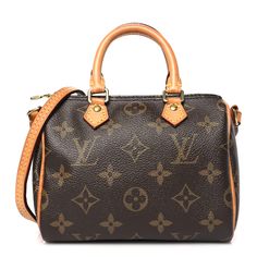 This is an authentic LOUIS VUITTON Monogram Nano Speedy. This stylish, petite tote is crafted of Louis Vuitton monogram on coated canvas. The shoulder bag features vachetta cowhide rolled leather top handles, a vachetta shoulder strap, with small polished gold links. The top zipper opens to a cocoa brown fabric interior. Nano Speedy, Stylish Petite, Cocoa Brown, Brown Fabric, Leather Top, Authentic Louis Vuitton, Louis Vuitton Monogram, Cocoa, Shoulder Strap