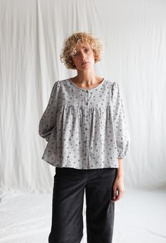 Puffy sleeve top made from a beautiful soft floral double gauze cotton. Elegant and grown-up, this blouse offers any number of styling options.

• Handmade in our studio
• Loose fit
• Round neckline
• Buttons opening through
• 3/4 length puff sleeves with elasticated cuff
• Available from XXS to XXL size or can be made in a custom size Puffy Sleeve Top, Soft Floral, Puff Sleeve Blouse, Double Gauze, Body Image, Body Positivity, Round Neckline, Puff Sleeve, Custom Sizing