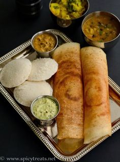 some food is sitting on a silver tray