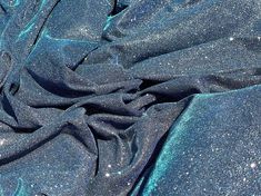 the fabric is shiny and blue in color