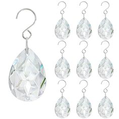 six pairs of clear crystal tears hanging from hooks