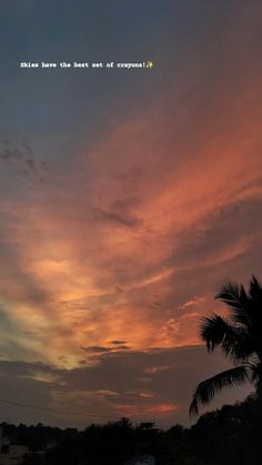 the sun is setting behind some palm trees and clouds in the sky with words written on it