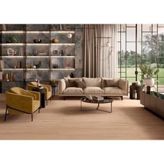 a living room filled with furniture next to a large glass wall mounted book shelf on top of a hard wood floor