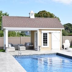 a backyard with a pool, lounge chairs and an outdoor living area in the background