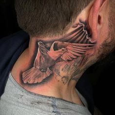 a man with a neck tattoo that has a bird on it's back side