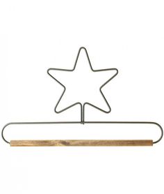 a metal object with a star on it and a wooden stick in front of it