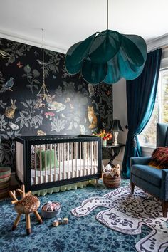 a baby's room decorated in blue and green