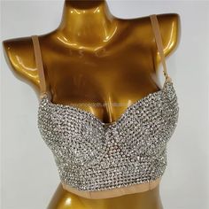 This Circle Rhinestone Chain Bra from Primadons and Donnas is a must-have for any fashionista. The bra is made with rhinestones and features a cut-out style crystal broach in the middle with adjustable chain drape sides. Silver is processed in 1 business day, while gold takes around 10 business days. This stunning piece is perfect for any special occasion or night out. With its unique design and quality craftsmanship, you'll be sure to turn heads. Get your Circle Rhinestone Chain Bra today and m Rhinestone Corset, Chain Bra, Bodysuit Tops, Corset Bra, Bodysuit Jumpsuit, Full Body Suit, Rhinestone Chain, Stocking Tights, Beach Swimwear