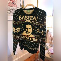 an ugly sweater hanging up on a rack