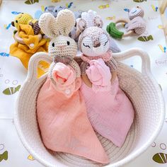 three knitted mice in a basket on a table