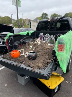 a truck with halloween decorations in the bed