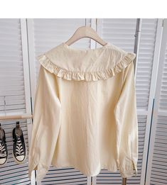 Casual Long Sleeve Cream Blouse, Cream Long Sleeve Casual Blouse, Casual Cream Long Sleeve Blouse, Cream Solid Color Top For Spring, Casual Off White Cotton Blouse, Beige Solid Color Blouse For Spring, Beige Solid Color Top For Day Out, Casual Long Sleeve Apricot Blouse, Cute Cream Blouse For Spring