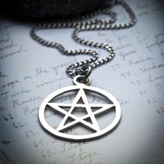 A classic witch amulet, a must!In many old grimoires dealing with magical evocation, the pentacle is described as being hung about the neck, providing protection and authority to the operator.I wear this with one or 2 other necklaces, it's really easy to layer and match with other tribal-witchy pieces. Pendant measures 25 mm in diameter and hangs on a curb chain. Sterling silverHandcraftedOxidized finish Witch Amulet, The Pentacle, Pentagram Jewelry, Pentacle Necklace, Pentagram Necklace, Witch Fashion, Silver Signet Ring, Ring Photos, Jewelry Inspo