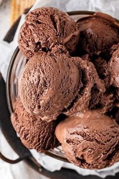 several scoops of chocolate ice cream in a bowl