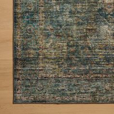 an area rug with blue and green colors