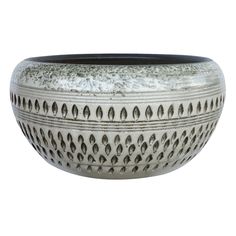 a white and black bowl sitting on top of a table