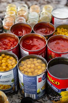 several cans of canned food sitting on top of a table