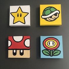 four square paintings with different designs on them, each featuring a mario mushroom and a star