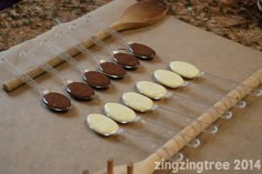 spoons with chocolate on them are lined up