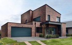 a large brick house with two garages