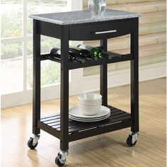 a kitchen cart with marble top and wheels